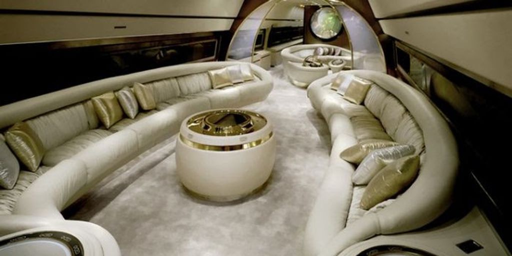 luxury private jet interior with gourmet meal