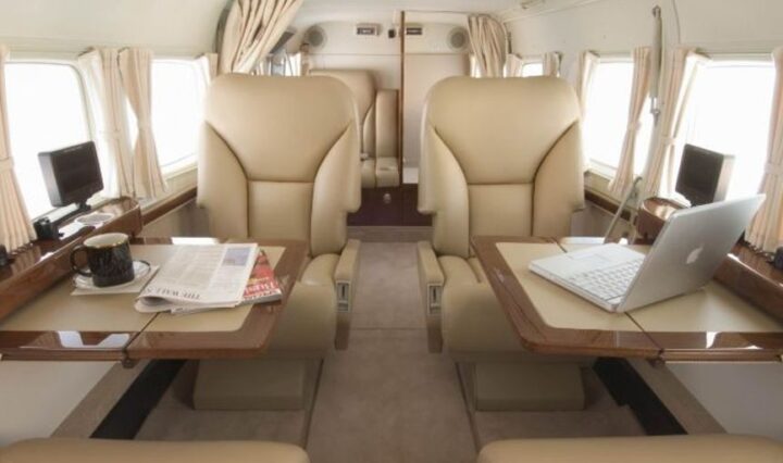 private jet interior with Wi-Fi and entertainment screens