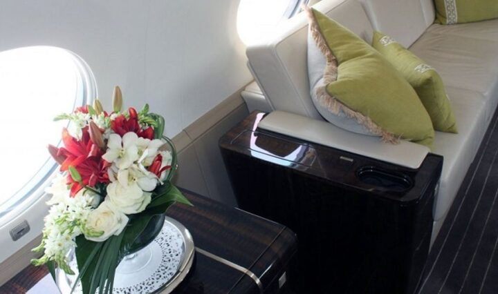 luxurious private jet interior with first-time flyer looking out the window