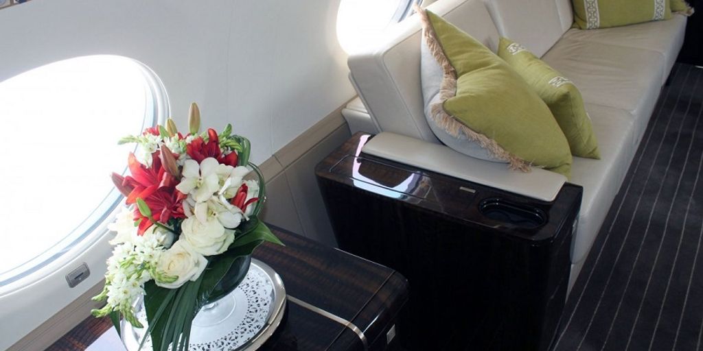 luxurious private jet interior with first-time flyer looking out the window