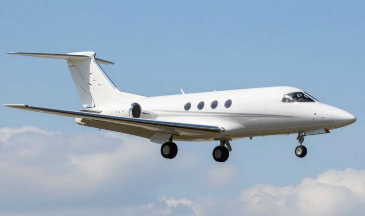 Very light jet flying in a clear blue sky.